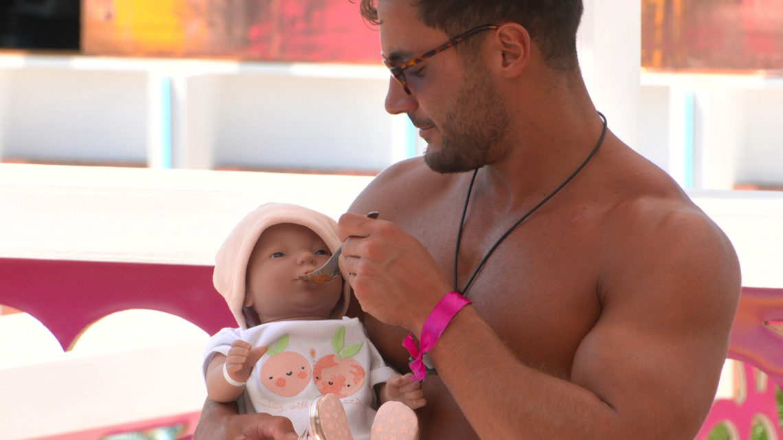 Davide with his toy baby on Love Island 2022