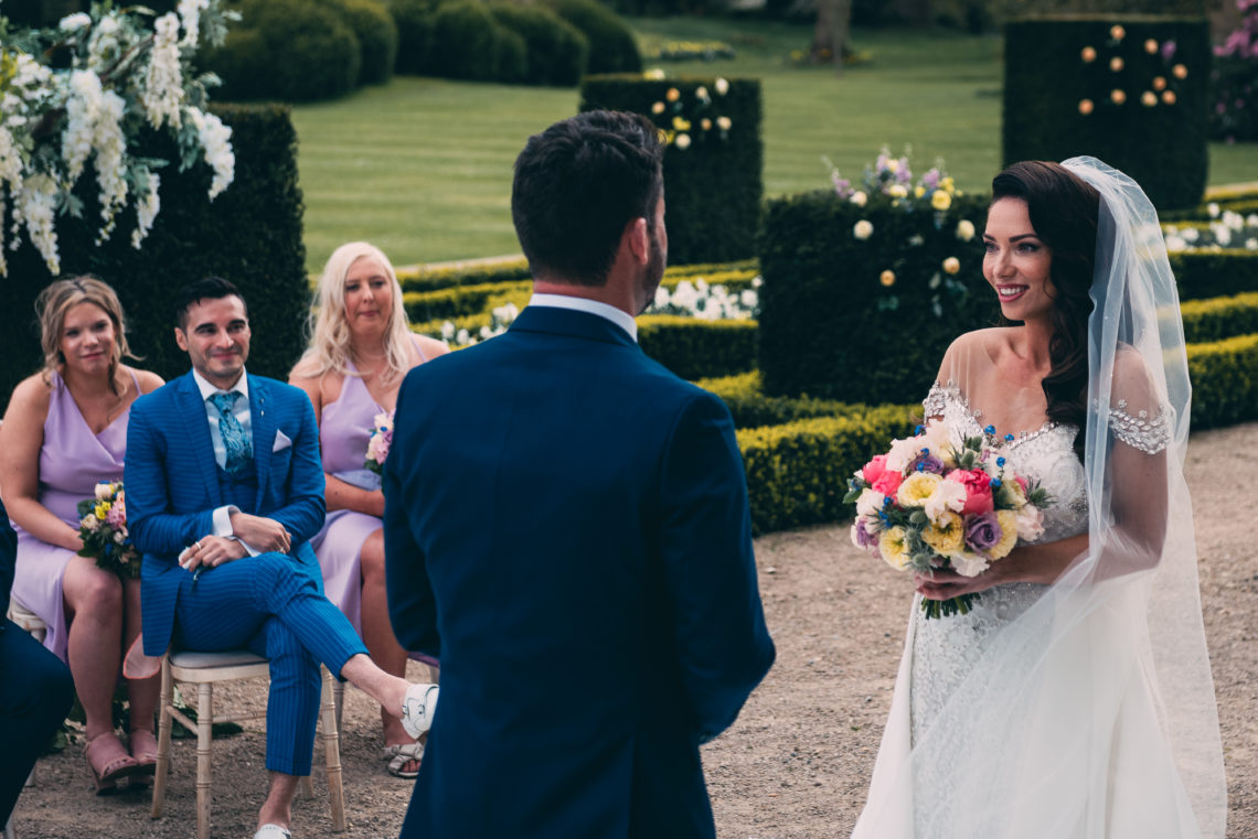 April Banbury says her vows to George at their wedding ceremony as best friend Jose looks on on Married at First Sight UK