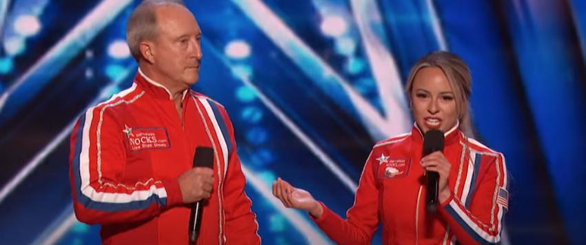 Father and daughter act The Nerveless Nocks introduce themselves on stage wearing red jumpsuits