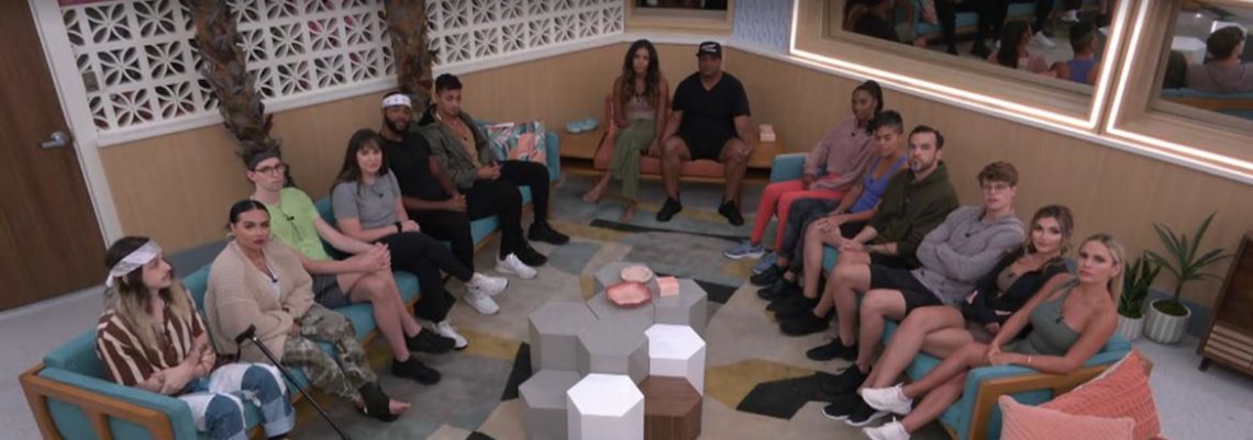 The Big Brother contestants sit on the sofas as the await the result of eviction night