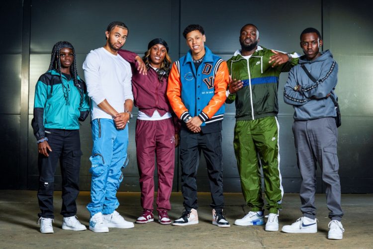 The Rap Game season 4 contestants pose in colourful outfits.