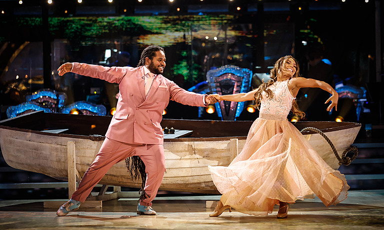 Jowita Przystal wears a cream ballgown & Hamza Yassin wears a pink suit, both dance together on Strictly Come Dancing 2022