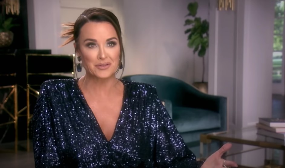 Kyle Richards wears a blue sequin dress as she explains to the camera about doubts over the Wives trip to La Quinta