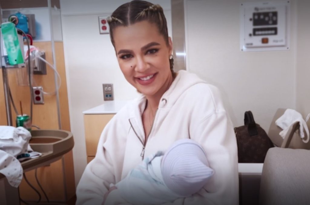 Khloe holds her baby boy close after he is born via surrogate
