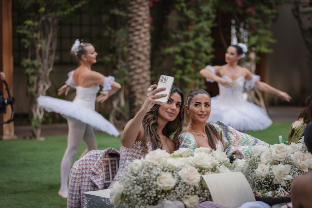Zeina Khoury and Safa Siddiqui sit together for a selfie on Dubai Bling