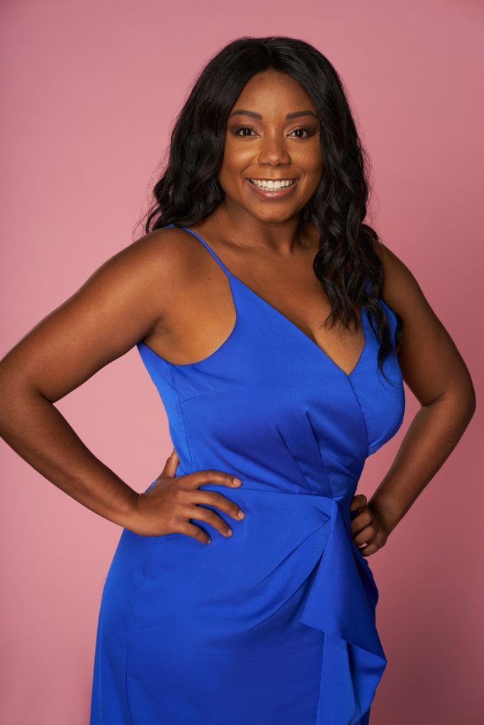 Kalekia Adams wears a blue dress and stands with her hands on her hips in season 3 of Love Is Blind.