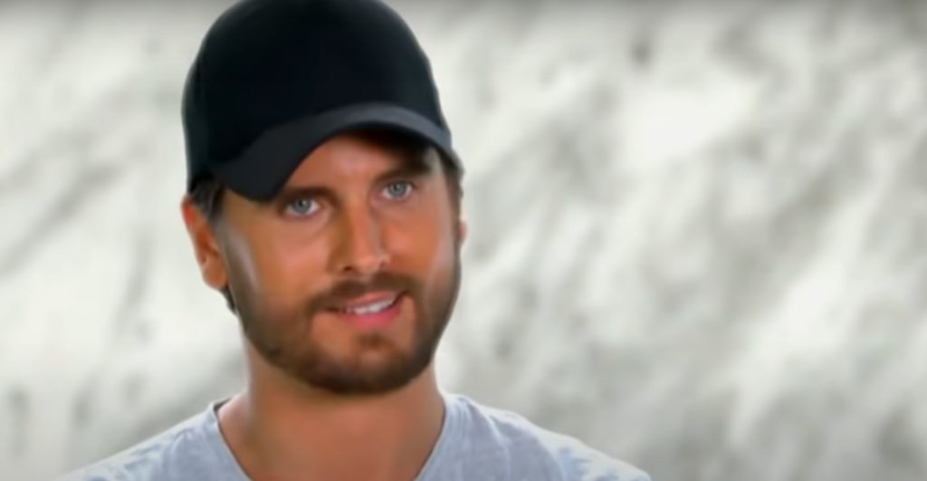 Scott Disick looks at a helicopter with Caitlyn Jenner