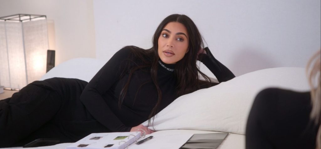 Kim Kardashian chatting with Khloe Kardashian in The Kardashians season 2