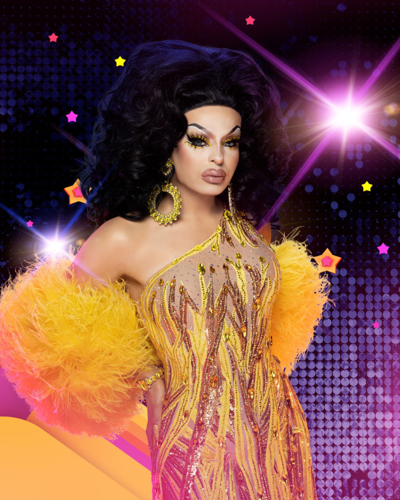 Icesis Couture poses in a yellow dress with fur for BBC press photos for Canada's Drag Race vs The World