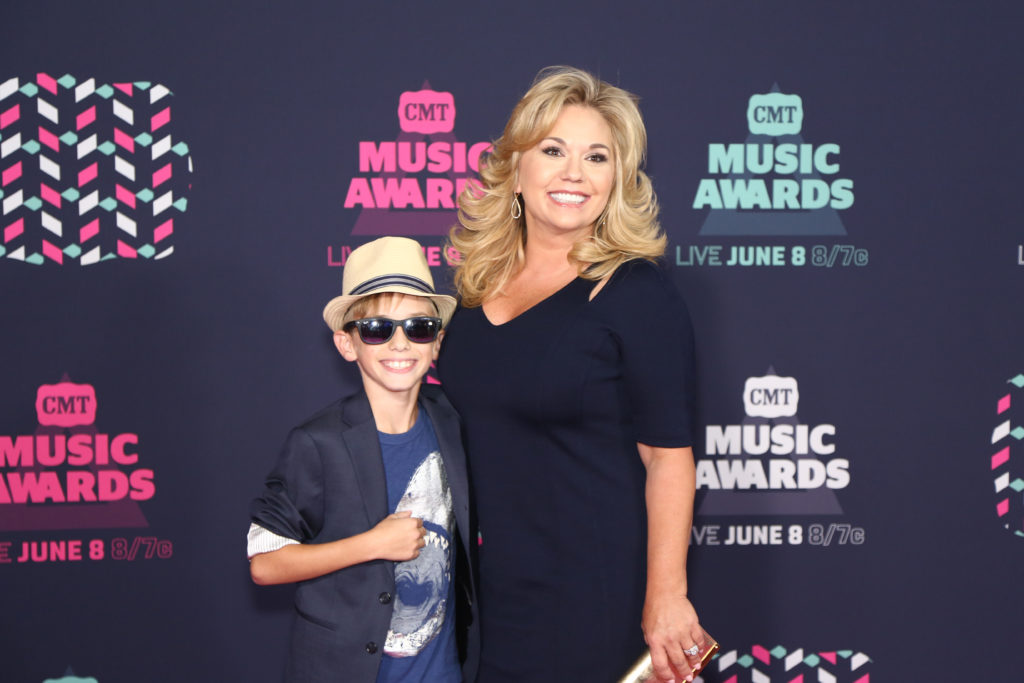 Grayson Chrisley poses with his mother Julie Chrisley at the 2016 CMT Music Awards