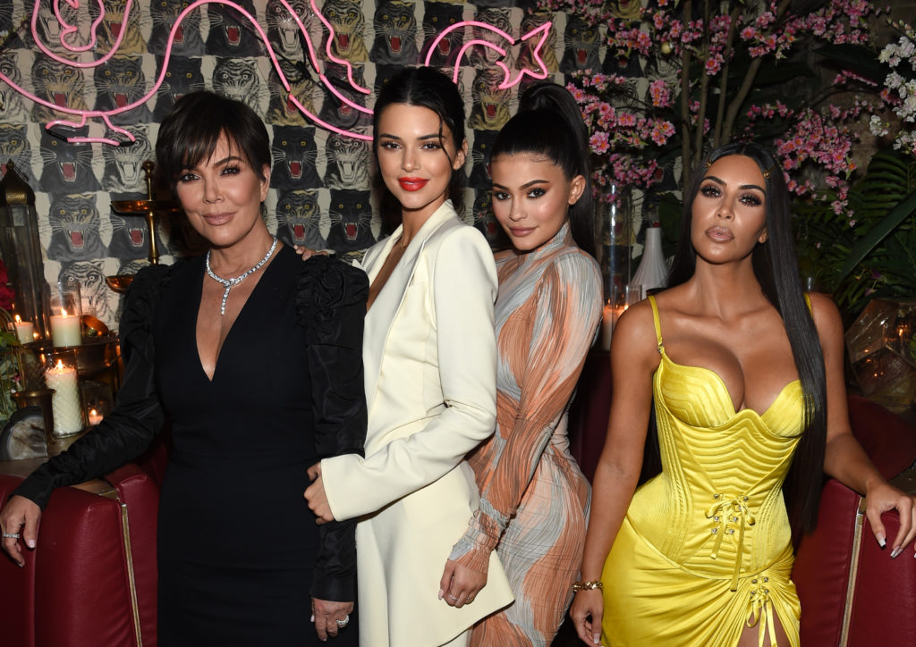 Kris Jenner, Kendall Jenner, Kylie Jenner and Kim Kardashian pose together for a group photo wearing evening dresses