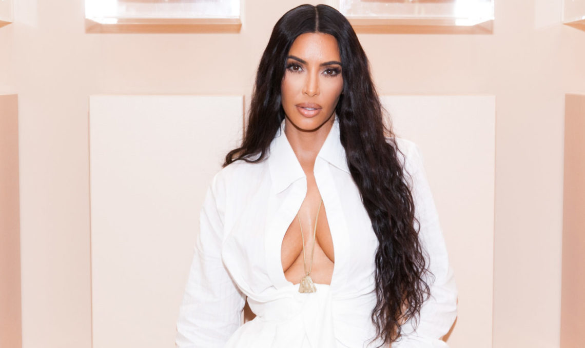 Kim Kardashian is a vision in white as she shows off curves in sheer dress