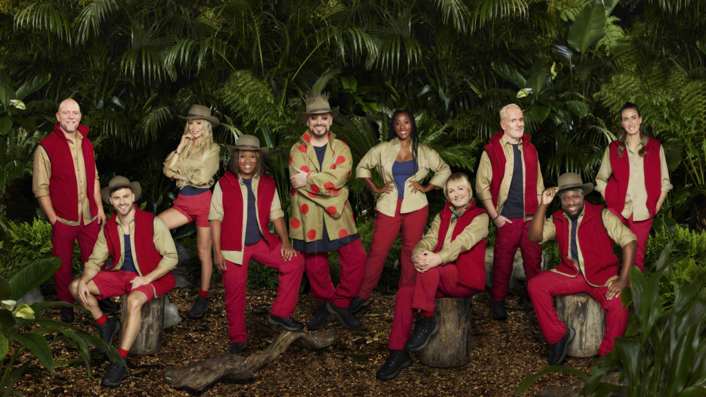I'm A Celebrity cast members of 2022 show pose for group promo photo in campmate outfits