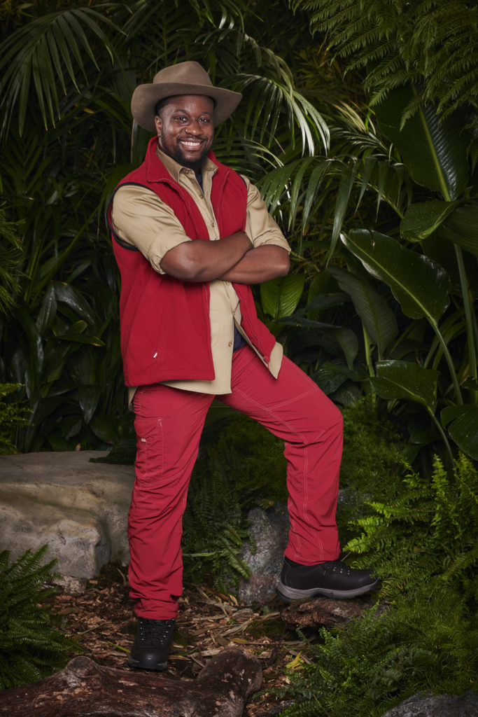 Babatunde Aleshe wears I'm A Celeb outfit as he poses for promo for series 22