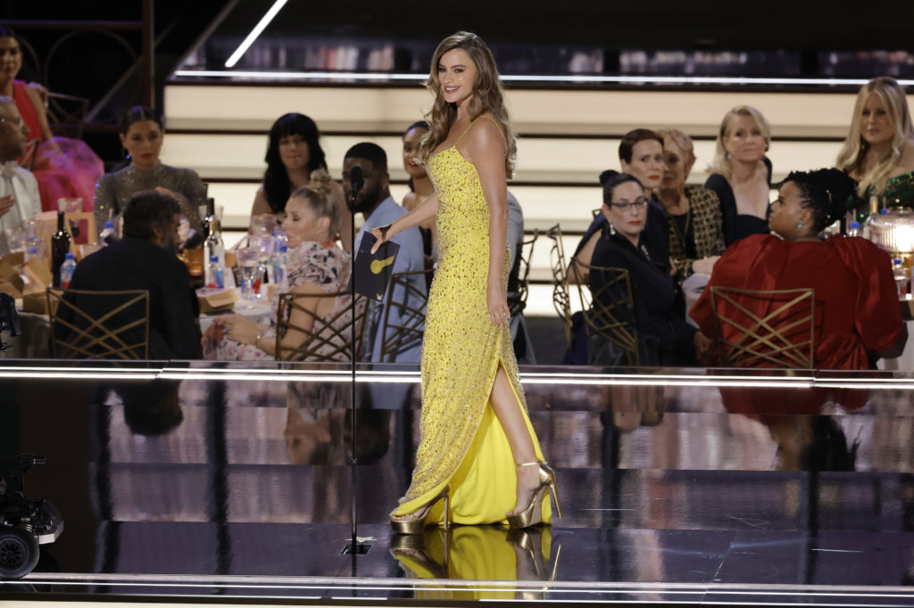 Sofia Vergara attends the 74th Primetime Emmys wearing a floor-length yellow dress