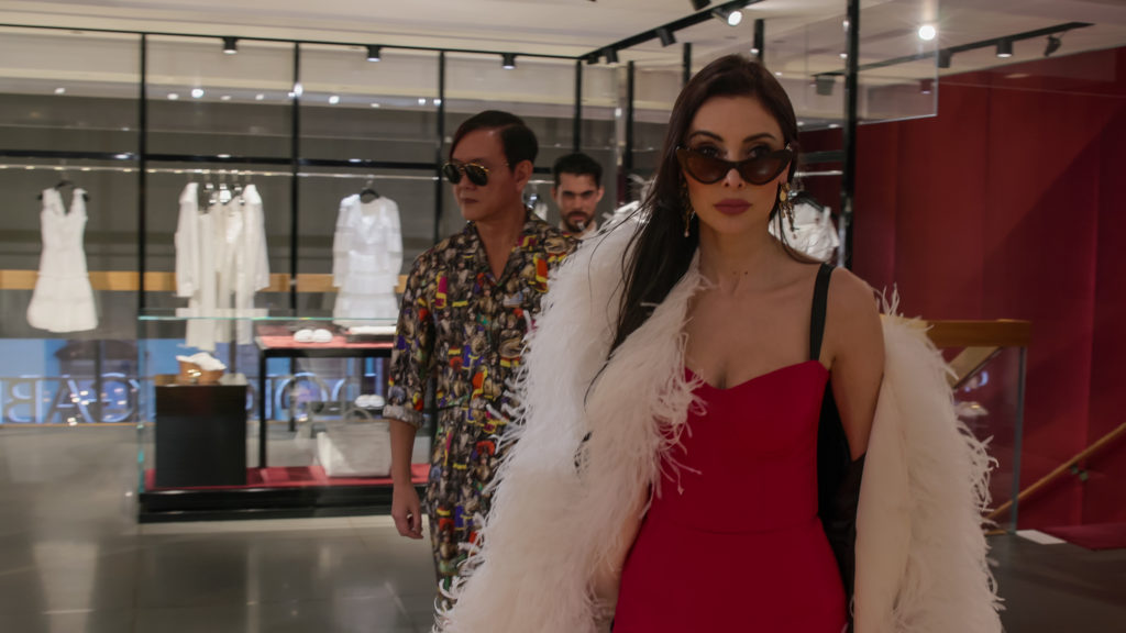 Stephen and Deborah Hung walk through a store on Bling Empire wearing designer clothes