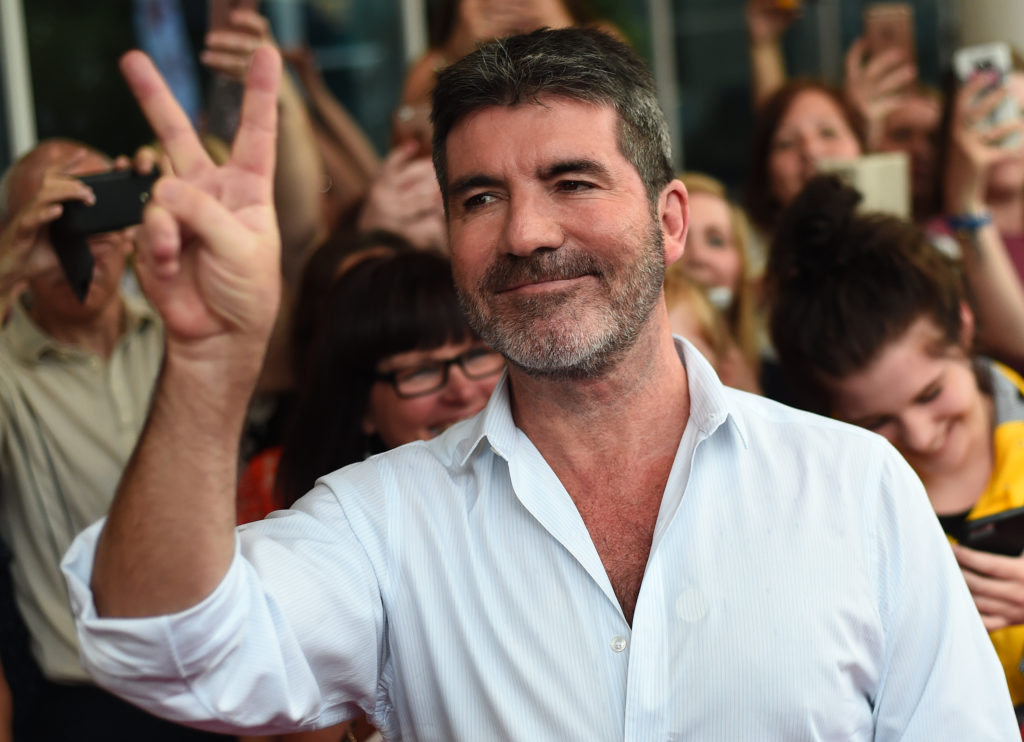 Simon Cowell holds up peace sign with finger at X Factor Auditions 2016 - Leicester