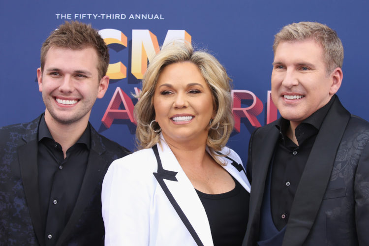 Chase Chrisley and his fiance enjoy Miami while parents serve jail time