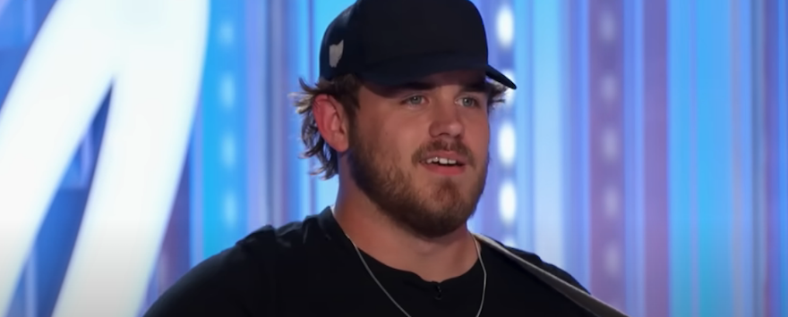 Jon Wayne Hatfield wears black cap and black t shirt during American Idol audition
