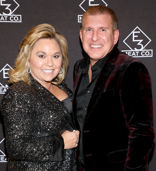 Todd and Julie Chrisley pose in black at E3 Chophouse Nashville Grand Opening Party