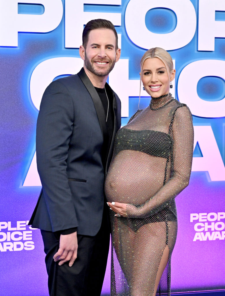 Tarek and Heather El Moussa attend 2022 People's Choice Awards smiling for camera, Heather has large baby bump