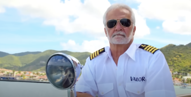 Captain Lee looking forwards on boat with scenic background