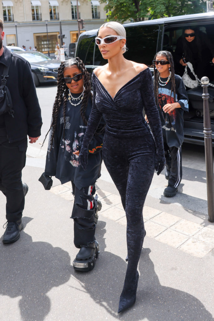 North West and Kim Kardashian walk together from car