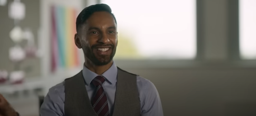 Bobby Seagull smiles at camera wearing waist jacket, shirt and tie on Indian Matchmaking