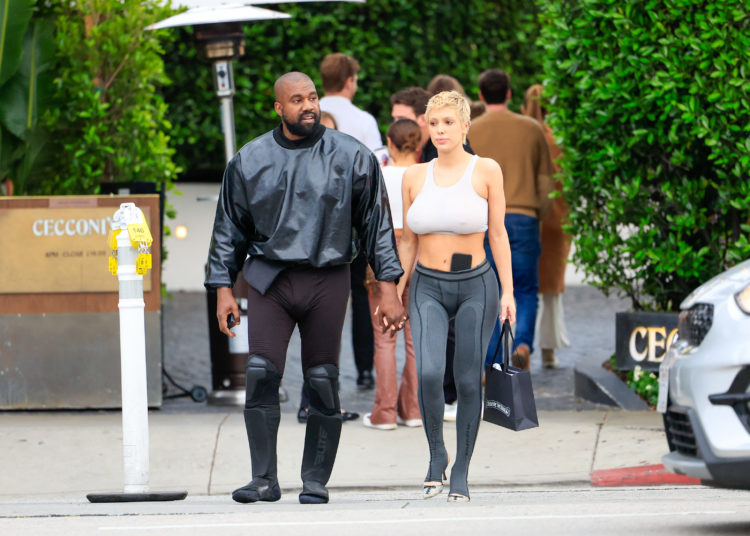 Kanye West looks like a new 'Sims character' with shoulder pads and blue socks