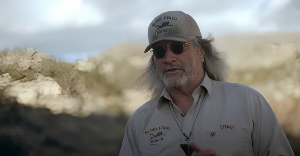 Duane Ollinger wears Blind Frog Ranch cap and shirt and dark sunglasses