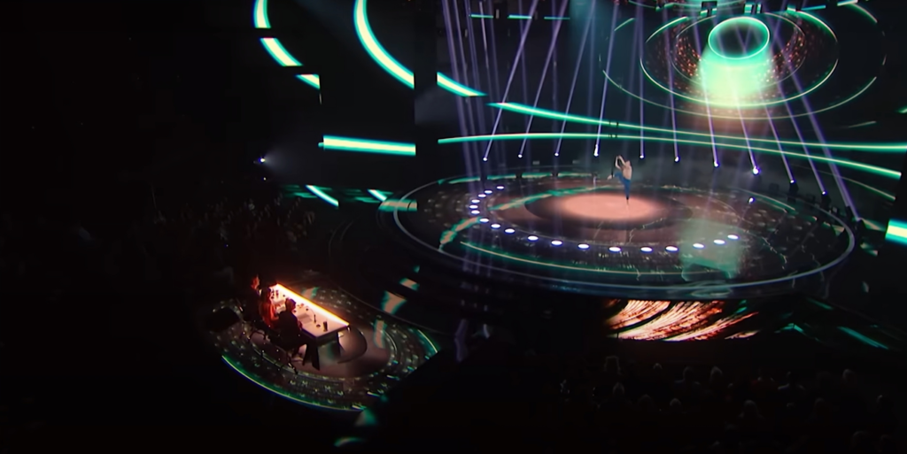 Wide view of Aidan Bryant performing on AGT stage