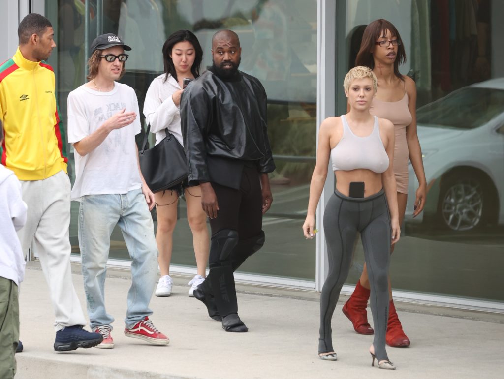 Kanye goes shirtless in Italy as Bianca sunbathes in nude-colored ...