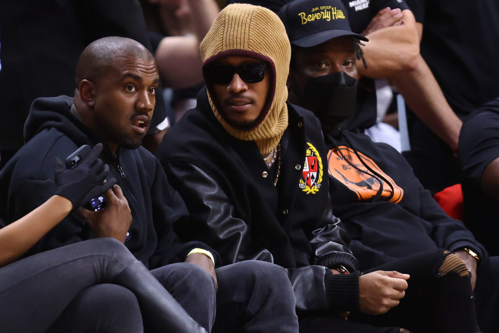Kanye West and Future sit court side at Minnesota Timberwolves v Miami Heat