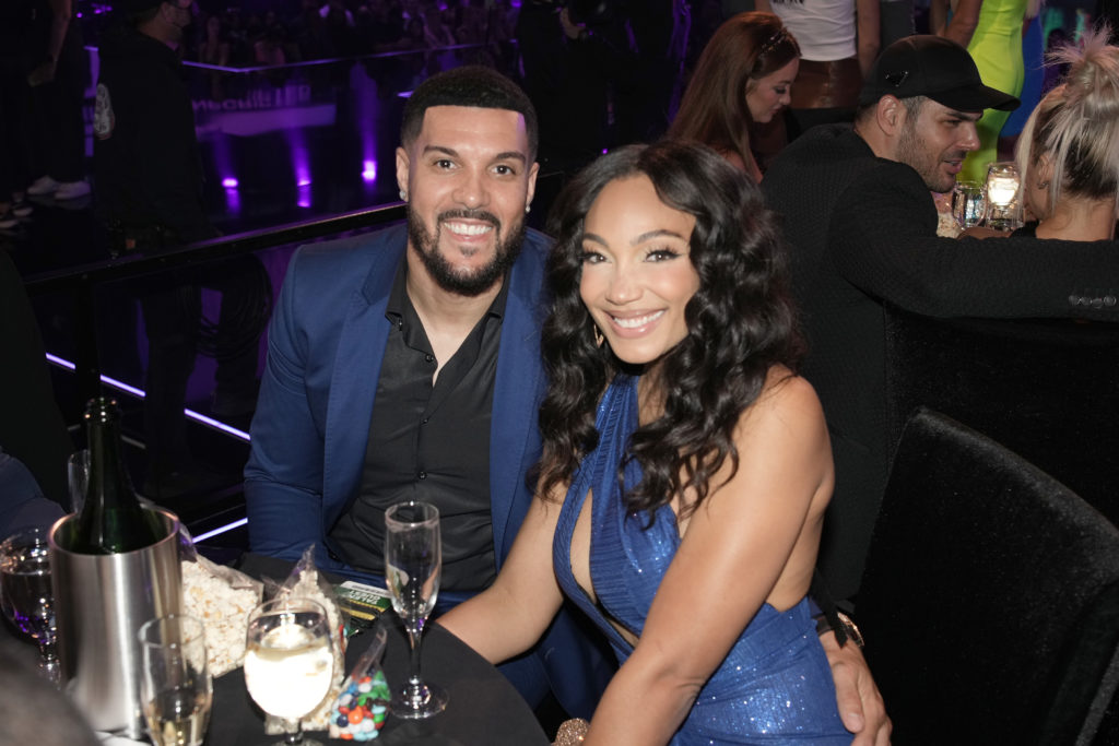 Brandi and Sean Marshall smile sitting at table attending 2022 MTV Movie & TV Awards: UNSCRIPTED – Show