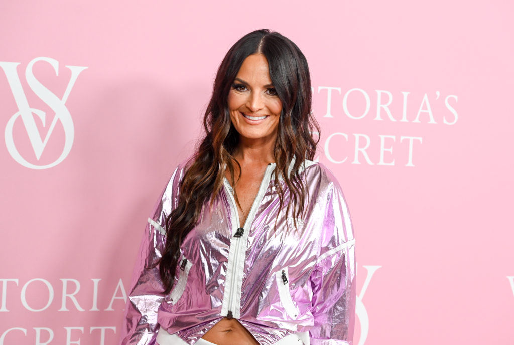 Lisa Barlow smiles on the red carpet at the Victoria's Secret World Tour 2023
